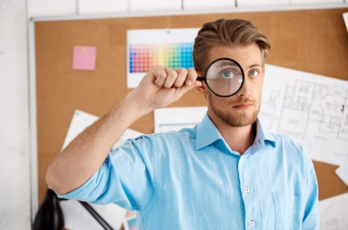 young-handsome-confident-pensive-businessman-standing-cork-board-through-magnifier-white-modern-office-interior_176420-6555 young-handsome-confident-pensive-businessman-standing-cork-board-through-magnifier-white-modern-office-interior_176420-6555